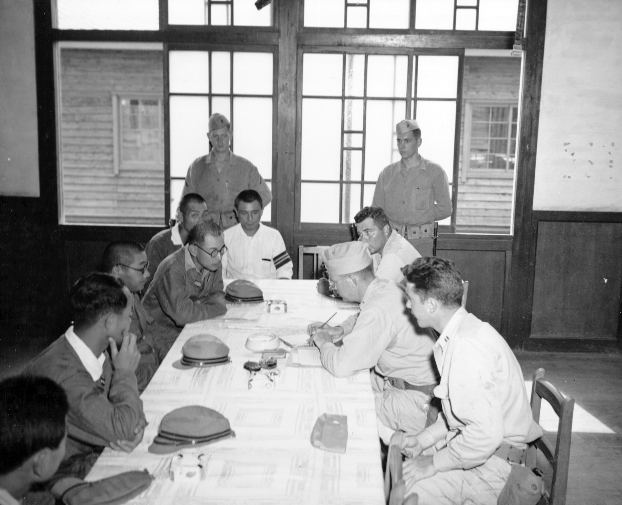 September 1945, Officers of the USS Boston accept surrender of Sasagama Chiba, Japan.  Norm Bayley (seated r)
